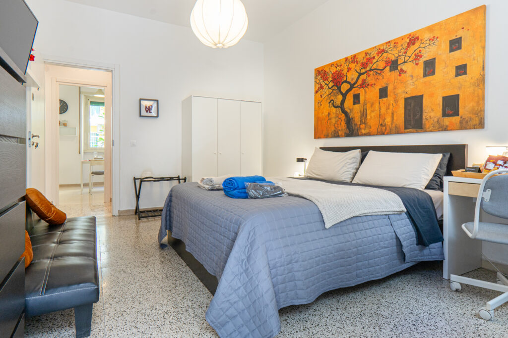 Camera matrimoniale di MaMa Rooms and Apartment